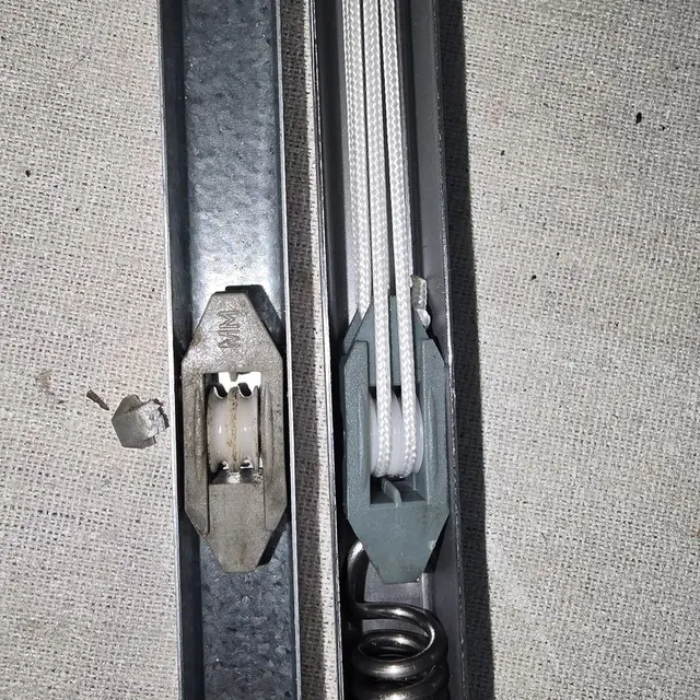 Window balancer spring mechanism close-up