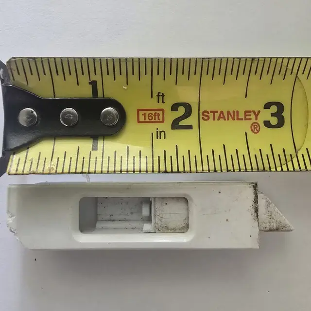 A clean replacement window latch part